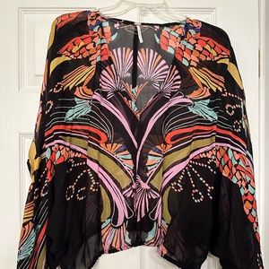 Free People v-neck sheer blouse, short with elastic bottom and winged sleeves